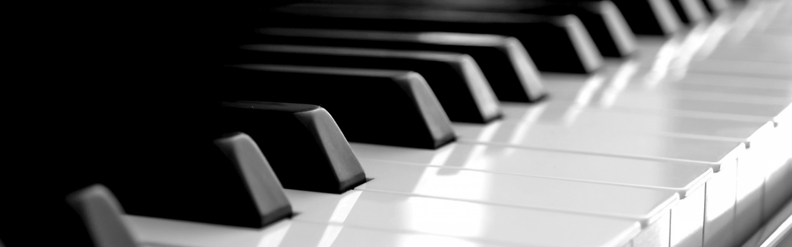 Close-up of piano keys showing black and white contrasts.